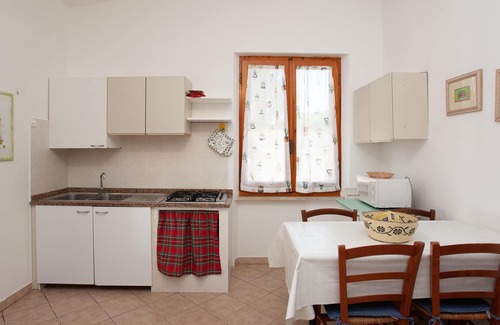 Cala Liberotto Apartamento | Apartamento Villa Peps cerca de la playa, con jardín
