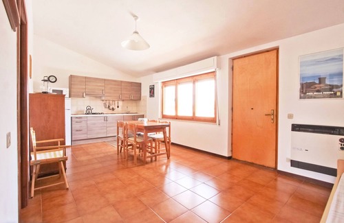 Il Poggio Apartamento | Apartamento con terraza con vista al lago y jardín privado cerca de la playa.