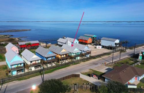Flour Bluff Casa | Balcony w Bay View Shared Pool Boat Dock Fat Flounder by AvantStay