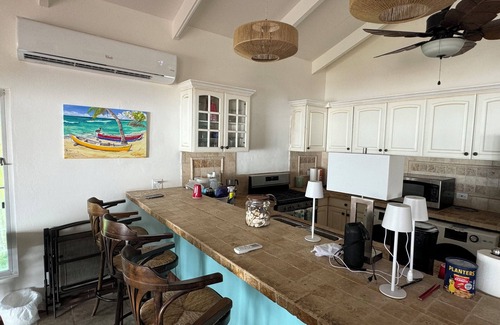 Cotton Valley Shores Villa | Beach Villa: Watch the Sunrise over the Caribbean Sea Walk right onto the Beach