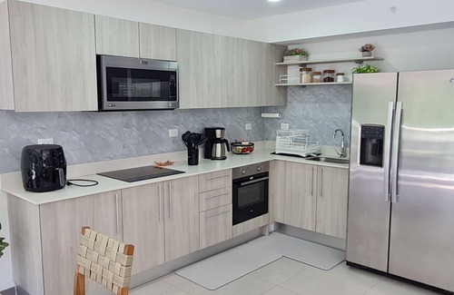 Punta Leona Apartamento | Beachfront condo-16th floor with stunning forest view. Steps to the sea.