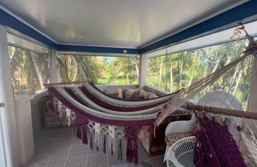 Tela Casa | Beachfront getaway,5 minutes from shore! Featuring a pool & recreational spaces.