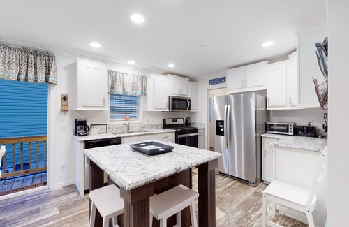 Montego Bay Casa | Beachy bayside home in quiet neighborhood with patio, central AC, pool, & tennis