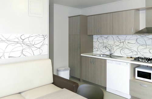 Grado Casa | Precioso apartamento en villa para 5 personas con A/C, piscina, WIFI, terraza y aparcamiento