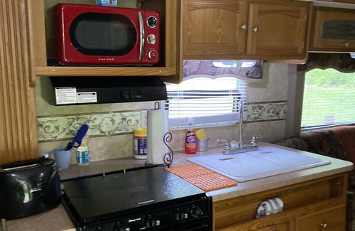 Dewittville Casa | Beautiful Camper on a country road.
