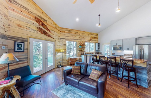 Three Rivers Casa | Beautiful riverfront home with private dock, fireplace, WiFi, and patio