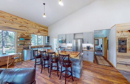 Three Rivers Casa | Beautiful riverfront home with private dock, fireplace, WiFi, and patio