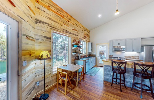 Three Rivers Casa | Beautiful riverfront home with private dock, fireplace, WiFi, and patio
