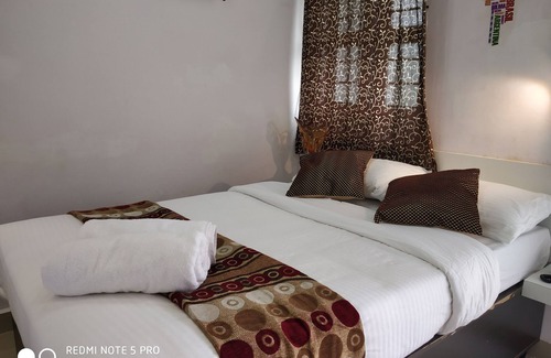 Mysore Hotel | Hermosas habitaciones rodeadas de naturaleza en el corazón de Mysore