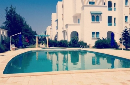Yasmine Apartamento | Hermoso apartamento con vista ubicado en Yasmine Hammamet con jardín, piscina.