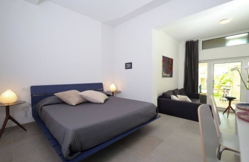 Palazzolo dello Stella Cama Y Desayuno | Bed and Breakfast Loggia degli Artisti 'Deluxe Room One' con piscina compartida y aire acondicionado