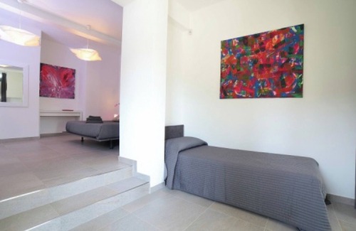 Palazzolo dello Stella Cama Y Desayuno | Bed and Breakfast Loggia degli Artisti 'Deluxe Room One' con piscina compartida y aire acondicionado