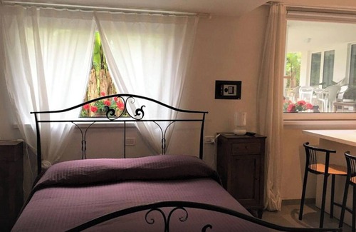 Palazzolo dello Stella Cama Y Desayuno | Bed and Breakfast Loggia degli Artisti 'Spacious Room' con Piscina, Wi-Fi y Aire Acondicionado