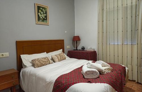 Lliria Casa | Bedroom with private bathroom and Two-Bedroom Family Suite in quiet forest country house 80m2 large swimming pool music town Lliria The garden and swimmingpool and garden are shared