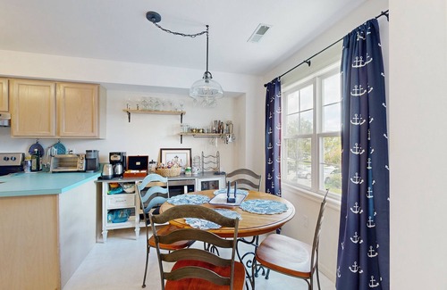 Ocean View Casa | Bethany Marina dog friendly bayfront townhouse w/pool, balcony, grill