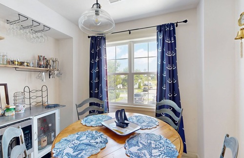 Ocean View Casa | Bethany Marina dog friendly bayfront townhouse w/pool, balcony, grill