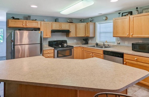 Piney Island Casa | Blue Heron, modern beach retreat with outdoor shower and screened porch