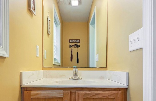 Piney Island Casa | Blue Heron, modern beach retreat with outdoor shower and screened porch
