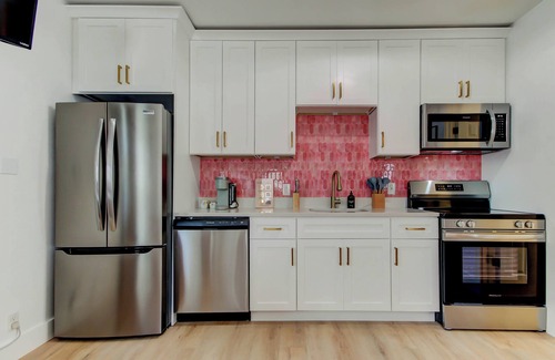 St. Petersburg - Clearwater Cabaña | Blushing Flamingo- Triplex with heated pool, across the street from the beach