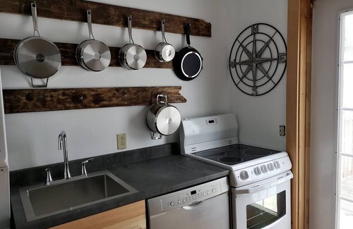 Cheticamp Apartamento | Boat house on the sea.
