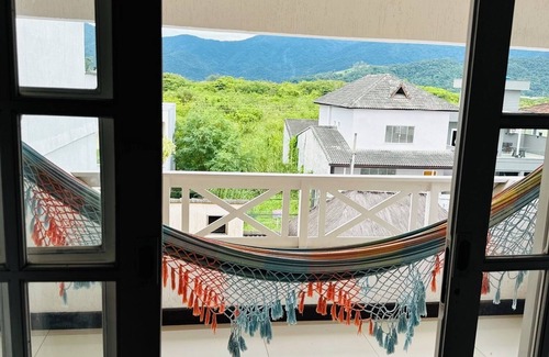 Vargem Grande Apartamento | Master suite with balcony. Recess of the pioneers.