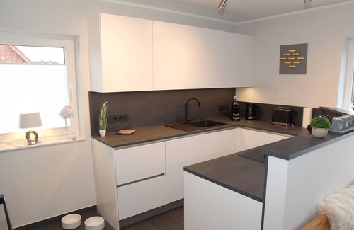 Eilsum Casa | Brand new 85sqm vacation home with dog permit directly on the water near Greetsiel!