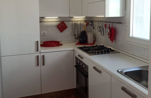 Cagnola Apartamento | Bright and modern one-bedroom apartment with terrace.