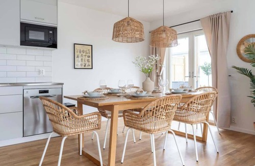 Bastad Condominio | Bright Ground Floor Corner Home with Cozy Outdoor