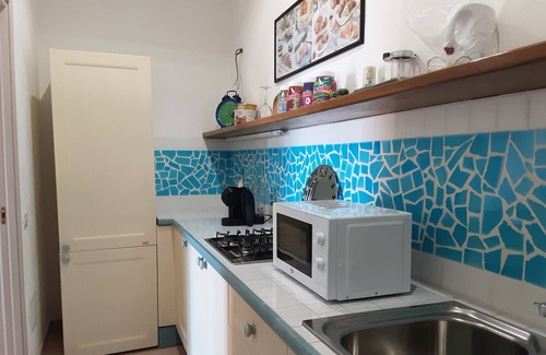 Santa Reparata Apartamento | Bright one-bedroom apartment with sea view a few steps from the beach