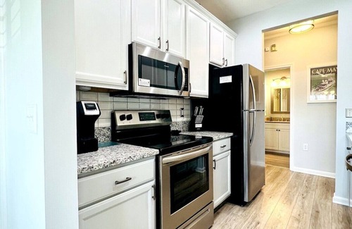 Villages of Five Points Condominio | Lewes DE Vacation Condo - 1 ° PISO - PERRO AMISTOSO - 2 piscinas - Tenis y senderos