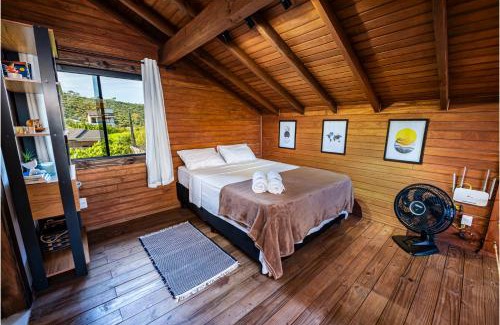 Vila Esperanca Casa | Cabana Perfeita a 800m da Praia - Lareira externa, Quintal Amplo, Pet Friendly, Ar condicionado, Netflix e Conforto completo