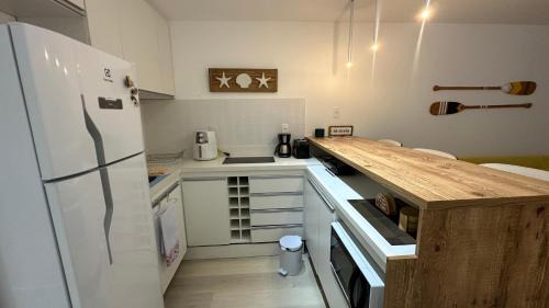Camboinhas Apartamento | Camboinhas Loft Vista Mar, Pé na Areia, com Piscina e Churrasqueira