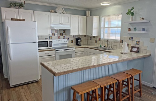 Grand Isle Casa | Camp Castaway - Beachfront - Island Realty