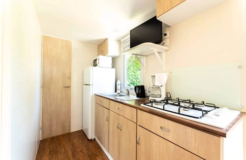 Canet-de-Salars Casa | Camping Le Caussanel* - Loggia Classic 26m² - Uncovered terrace - air conditioning - TV for 4 people