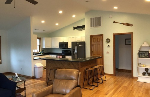 Colington Harbour Casa | Canal Front Home with Private Dock, Multiple Decks & Hot Tub