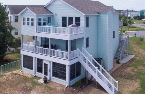 Colington Harbour Casa | Canal Front Home with Private Dock, Multiple Decks & Hot Tub
