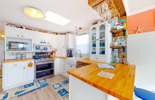 Montego Bay Casa | Canal front home with free WiFi, deck, private dock, shared pool & tennis