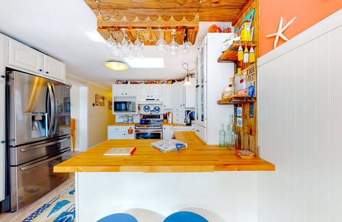 Montego Bay Casa | Canal front home with free WiFi, deck, private dock, shared pool & tennis