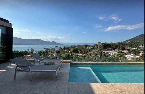 Itaguassu Casa | Casa com piscina aquecida, jacuzzi e 60 m da praia
