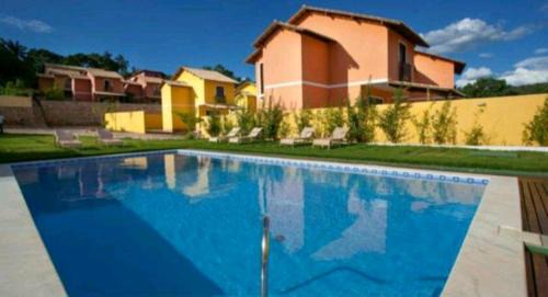 Lencois Casa | Casa confortável em condomínio com piscina