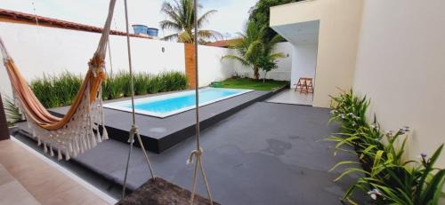 Porto Seguro Casa | Casa em Taperapuan com 3 Suítes e Hidromassagem