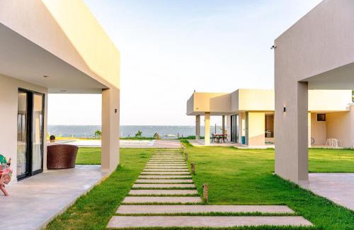 Porto de Pedras Casa | Casa Lages beira mar na Praia do Patacho by Qavi