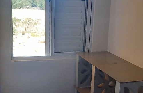 Jaguaruna Casa | Casa Pedra Ferrugem Balcony with hammock and sea view - 180m from the beach