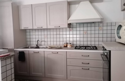 Villanova Strisaili Casa | "Casa Vacanze Bau Mela" con vista a la montaña y jardín compartido