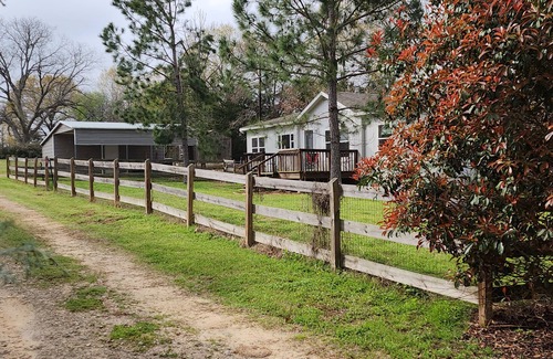 Tyler Casa | Cattlemens Quarters beautiful ranch setting with fenced yards and a great deck!