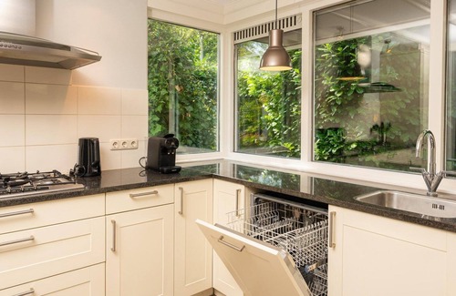 Lieren Casa | Central luxury group accommodation with five bedrooms, large kitchen, and enclosed garden. Plenty of privacy and comfort inside and out.