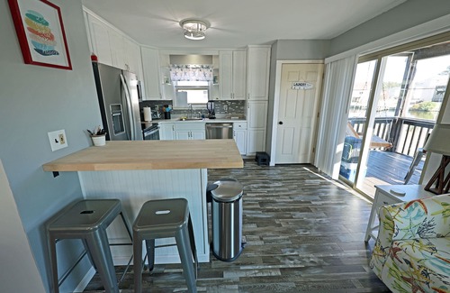 Colington Harbour Casa | CH219- 3 Bedroom Canal front Home with Private Dock and Kayaks!