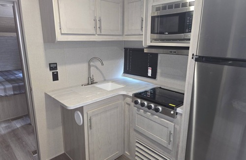 St. James Casa | Charming 2-bedroom Camper in Bolivia with WiFi and AC. Pet friendly!