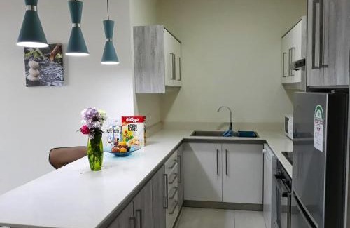 Flic-en-Flac Apartamento | Charming apartment in Flic en Flac with shared pool
