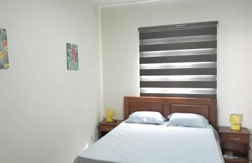 Flic-en-Flac Apartamento | Charming apartment in Flic en Flac with shared pool